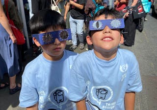 Seven-year-old twins Faron and Soren Walshe with their glasses in George's Street in Dublin to watch the eclipse on 12 August, 2026